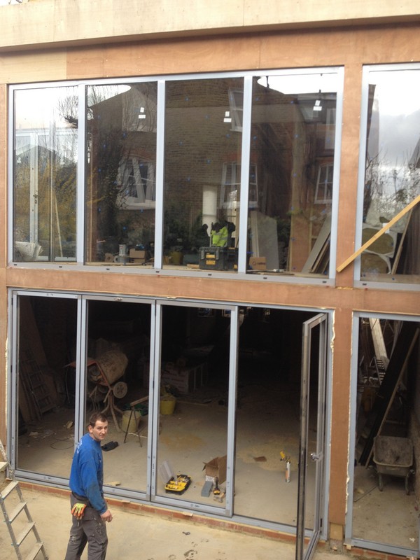 Aluminium bi-fold doors with two-storey glazing in Finsbury Park