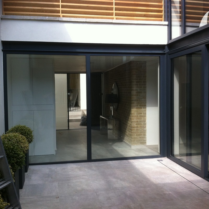 Floor-to-ceiling sliding doors opening to courtyard in Finsbury Park