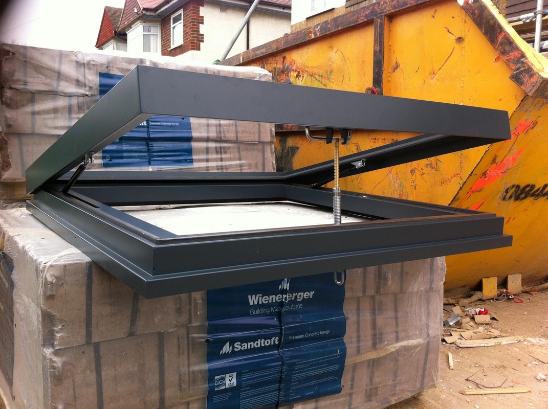 Opening flat roof skylight in anthracite grey installed in Finsbury Park